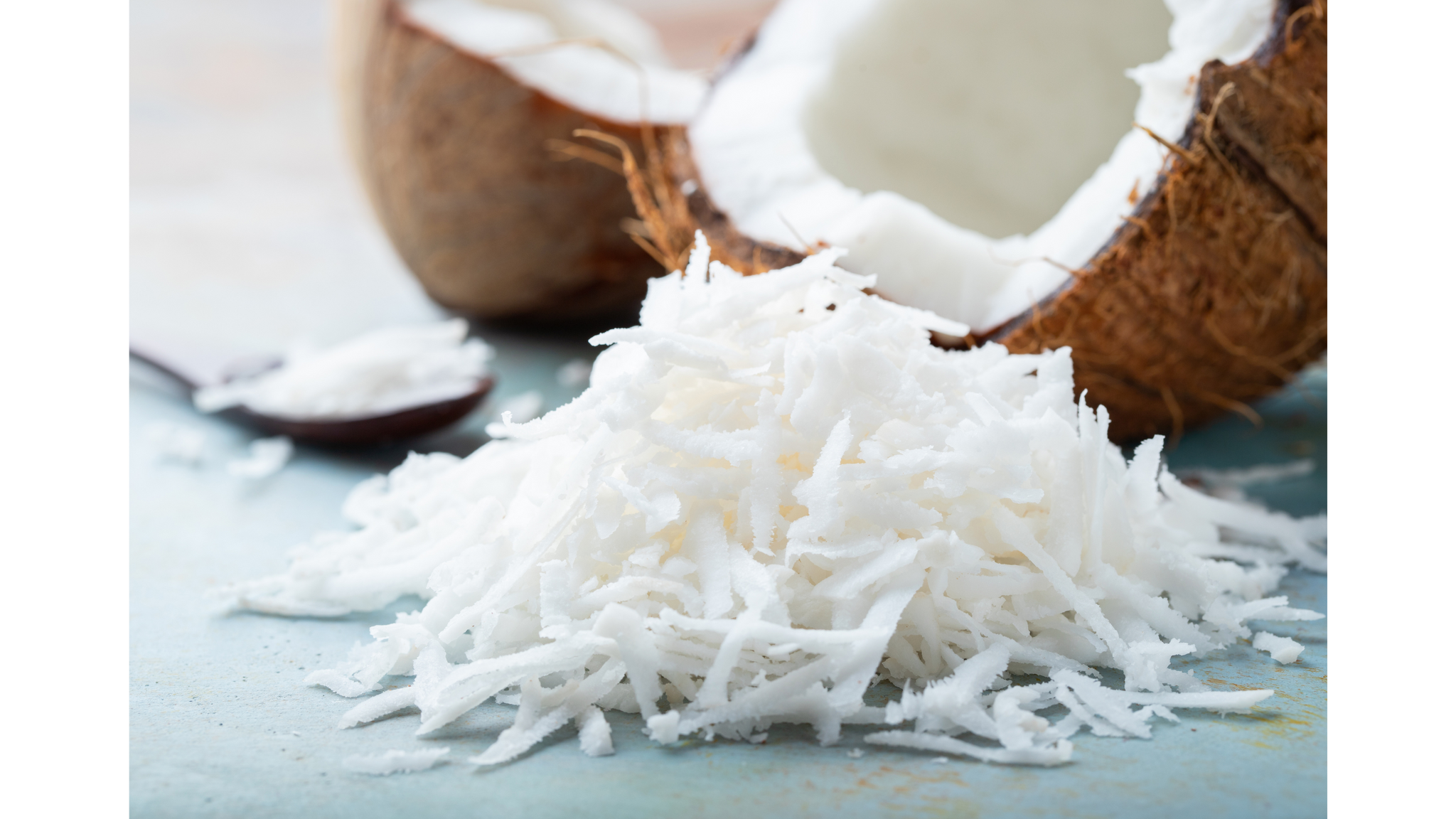 
                  
                    Shredded coconut on a light blue surface with a halved coconut in the background relcha teas
                  
                