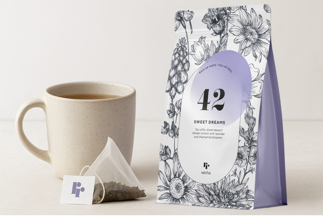 
                  
                    Tea bag with packaging labeled '42 Sweet Dreams' next to a cup of tea on a white background
                  
                